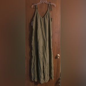 Super cute green colored romper.